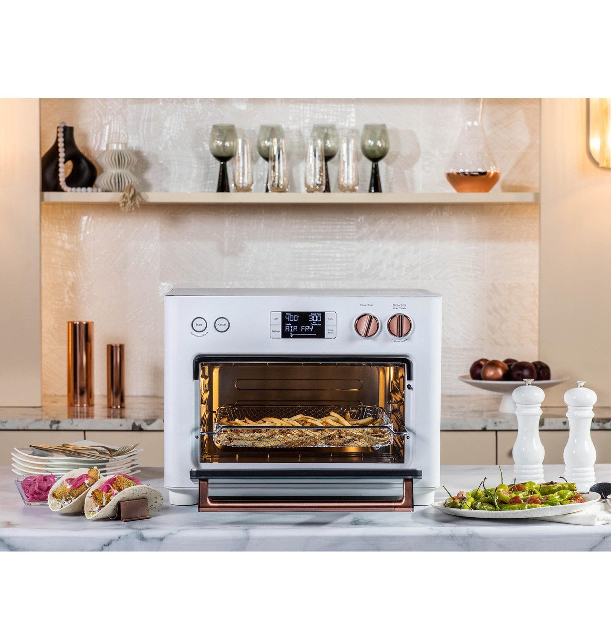 Café Appliances Couture countertop oven with air fry and copper trim in a kitchen